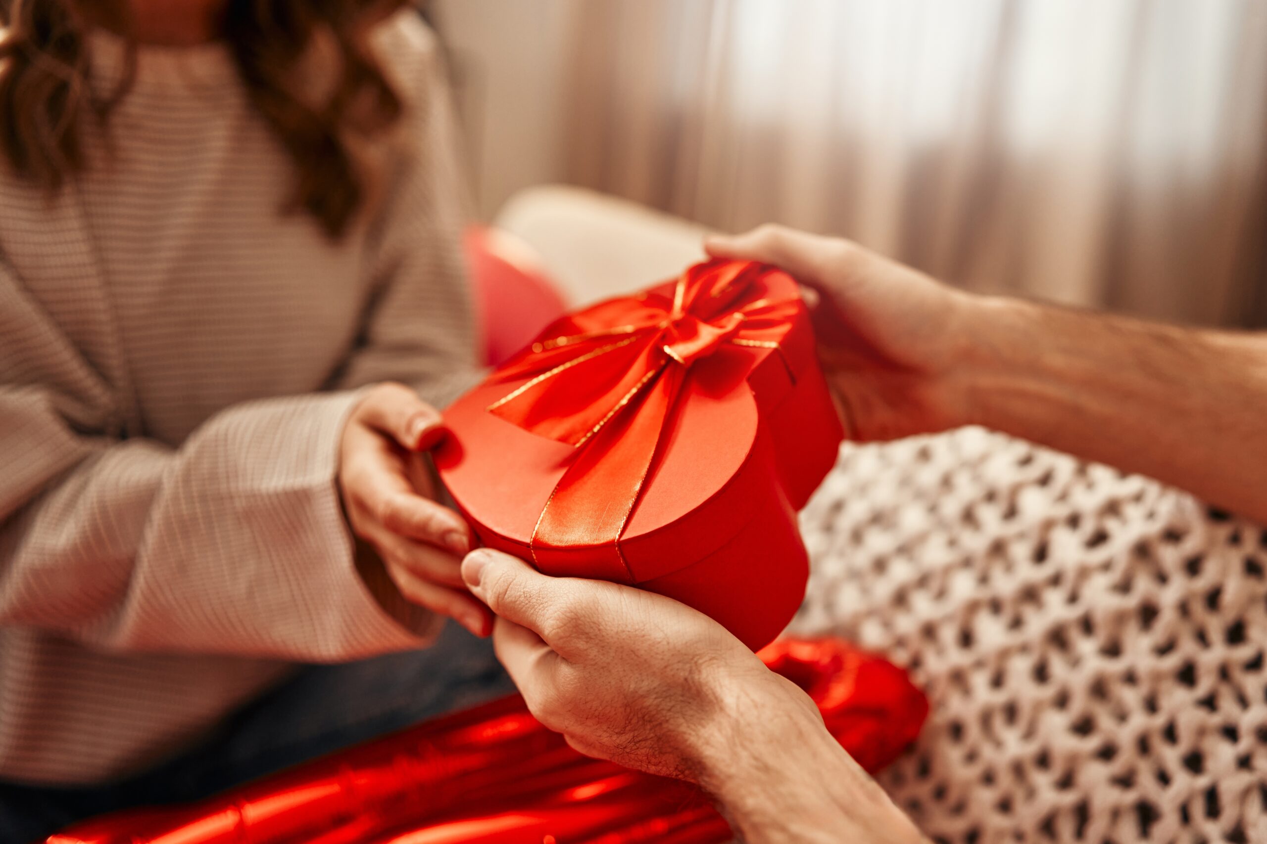 a person holding a red heart shaped box . Give Yourself the Gift of Health for The New Year! - The Holistic Highway: Ayurveda Sanctuary - Ayurvedic Meal Plan - Transformational Wellness Program - Dosha Quiz: Vata - Pitta - Kapha - Skincare Quiz